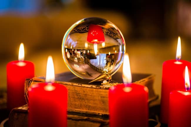 Candles around crystal ball